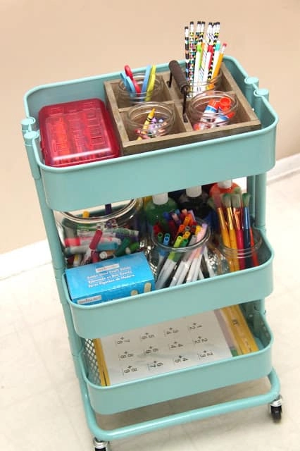 This three-tiered Raskog storage cart from IKEA is transformed into a homework station with art supplies, markers, crayons, paper and more.