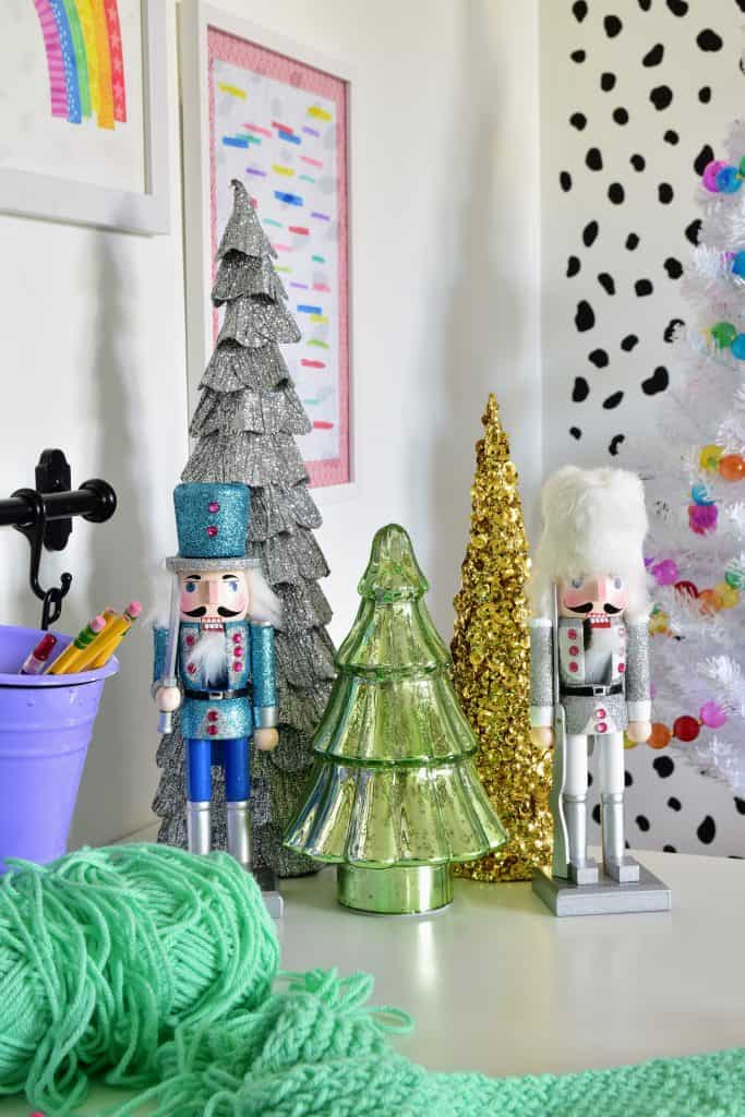 nutcrackers and trees on desk